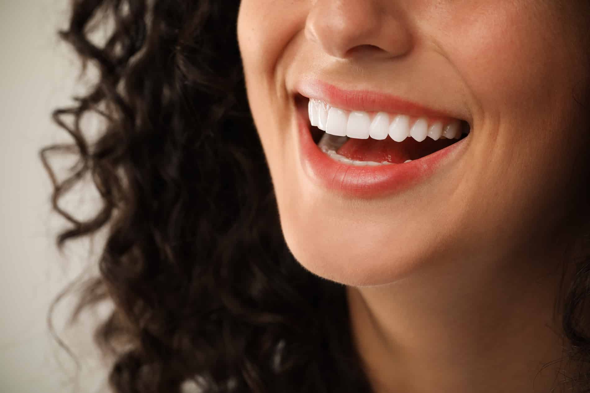 Woman smiling with dental implants in Winston-Salem