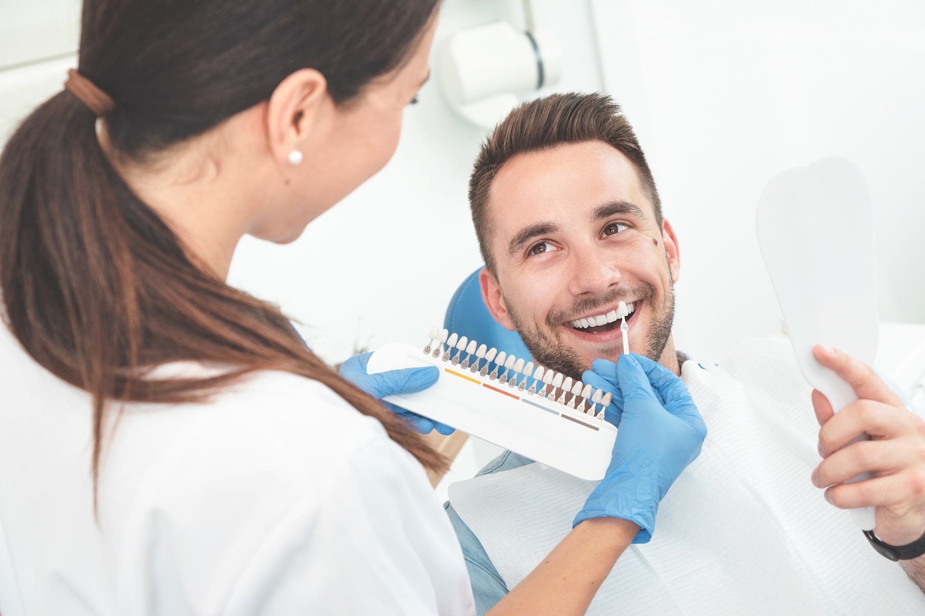 patient learning about what to expect from his dental implant procedure with helpful info from Twin Oaks Dentistry in Winston-Salem NC